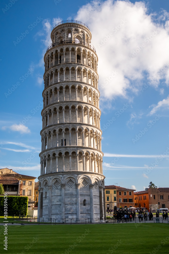 The sunlit iconic Leaning Tower of Pisa. Tuscany, Italy