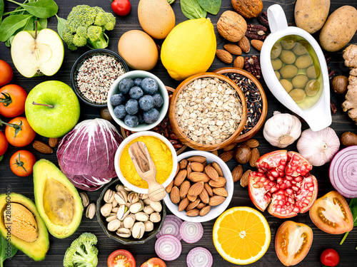 Ingredients for the healthy foods selection. The concept of healthy food set up on wooden background.