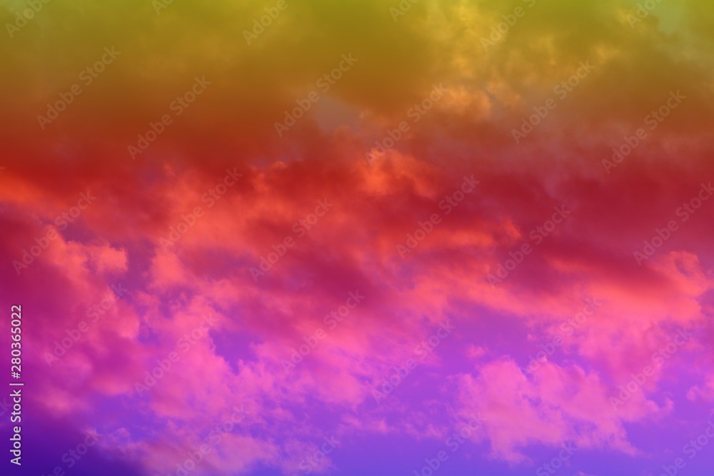 pretty unreal toned fantasy sun colored clouds on the sky for using in design as background.
