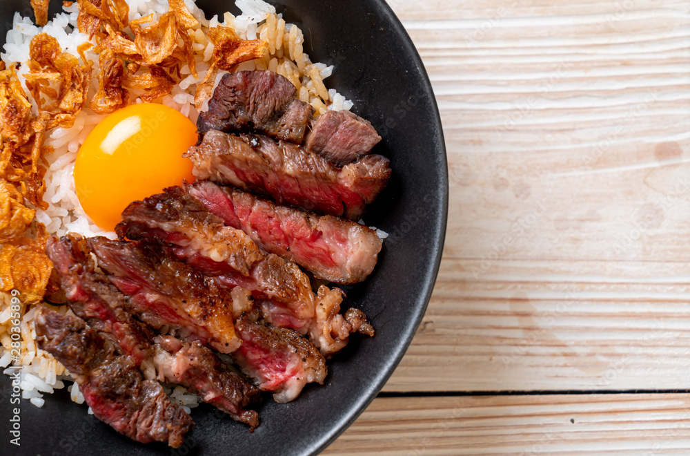 sliced beef on topped rice bowl with egg sliced beef on topped rice bowl with egg