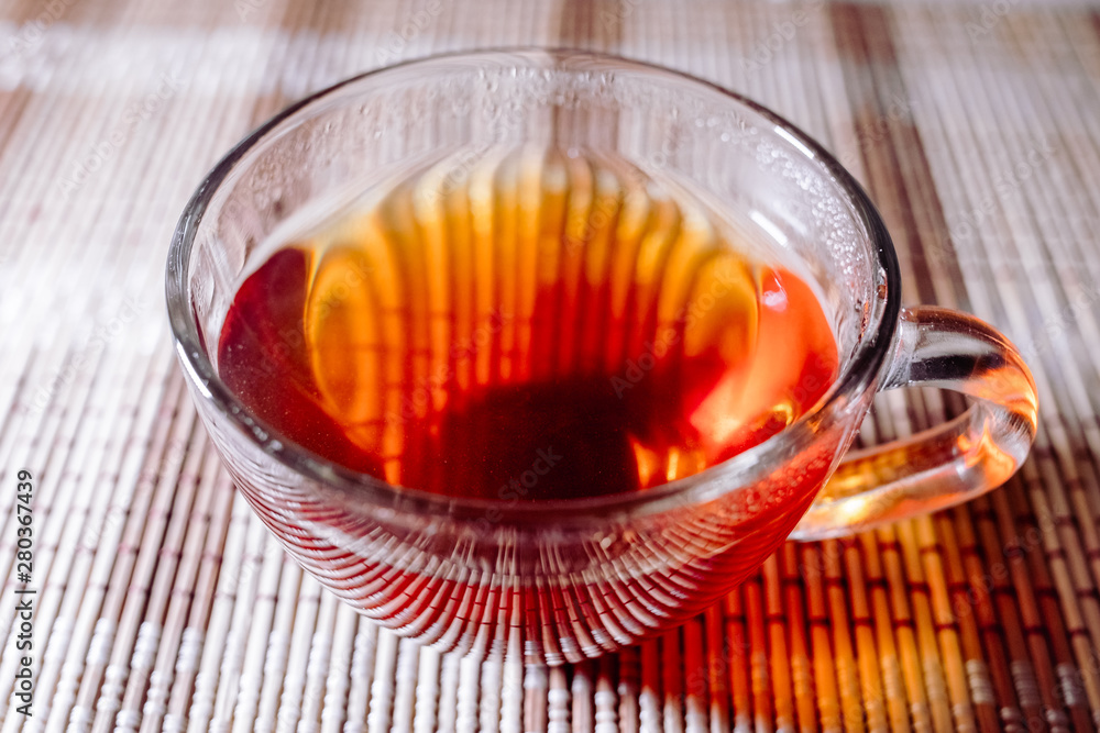 Fototapeta premium tea in a clear glass black