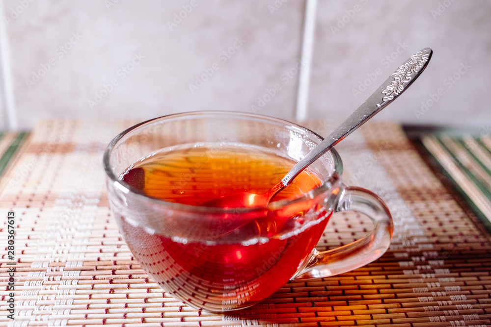 Fototapeta premium tea in a clear glass black