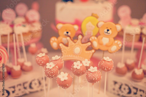 Cake pops pink on candy bar holder. Party sweets.