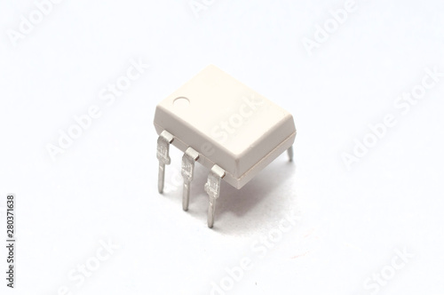 фотографія An optocoupler (or opto-isolator) electronic component on white background