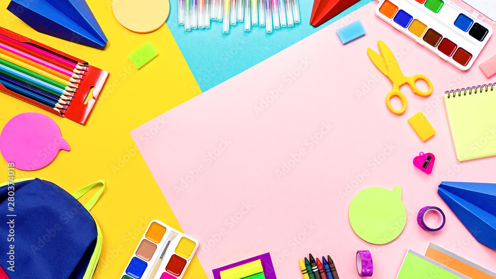 School supplies and lunchbox with food for kids. Colorful stationery layout on multicolor background, copy space School supplies and lunchbox with food for kids. Colorful stationery layout on multicolor background, copy space