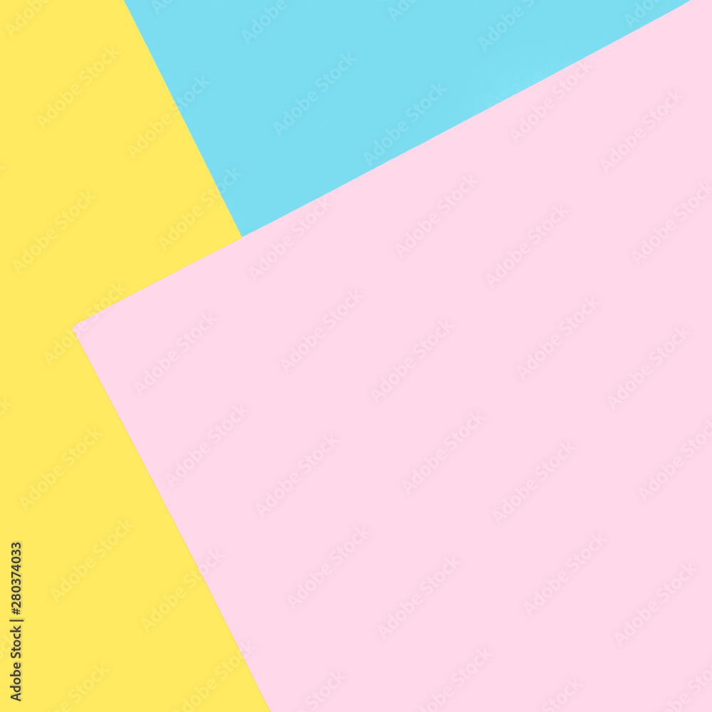Background of blue, pink, yellow papers. Geometric, minimal background in pastel colors