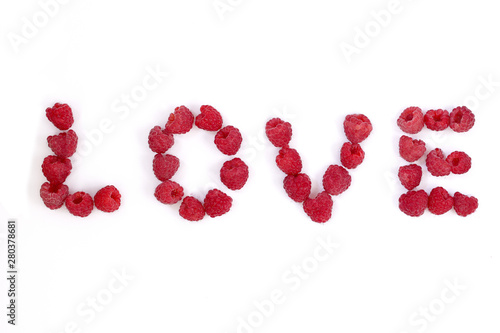 Word love made of raspberry. berry letters. fresh berries isolated on white background