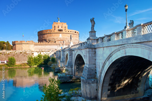 Image of a road to Castel Sant'Angelo castle and view of white Ponte Sant'Angelo bridge