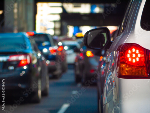 Close up of tail light of a car waiting in long queue of traffic. Stopped car with its brake lights on in the city of Melbourne, Australia.