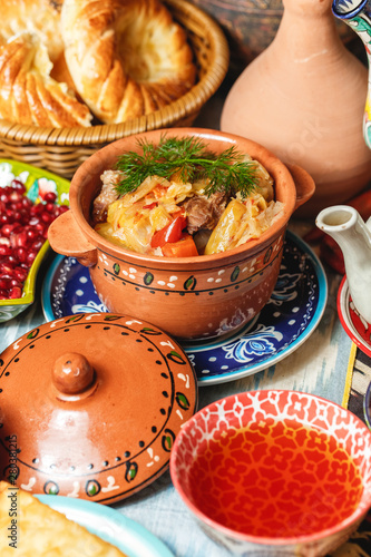 National Uzbek dish is bigus. Beef stew, stewed with cabbage, rice, tomatoes, pepper and seasonings photo