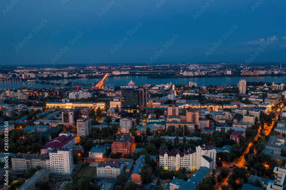 Obraz premium Aerial view of night city Voronezh after sunset, panorama cityscape