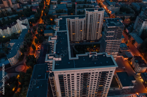 Flight above Night City buildings on drone  aerial view
