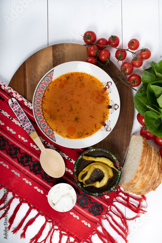 Top view of plate with meatballs soup, traditional plate of the Romanian cuisine, ciorba de perisoare photo