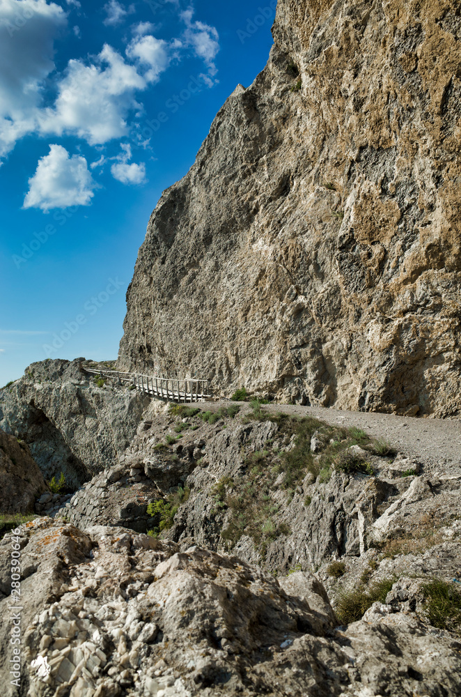 Wooden bridge along the mountain path near the Black Sea. Cape Alchak, Republic of Crimea