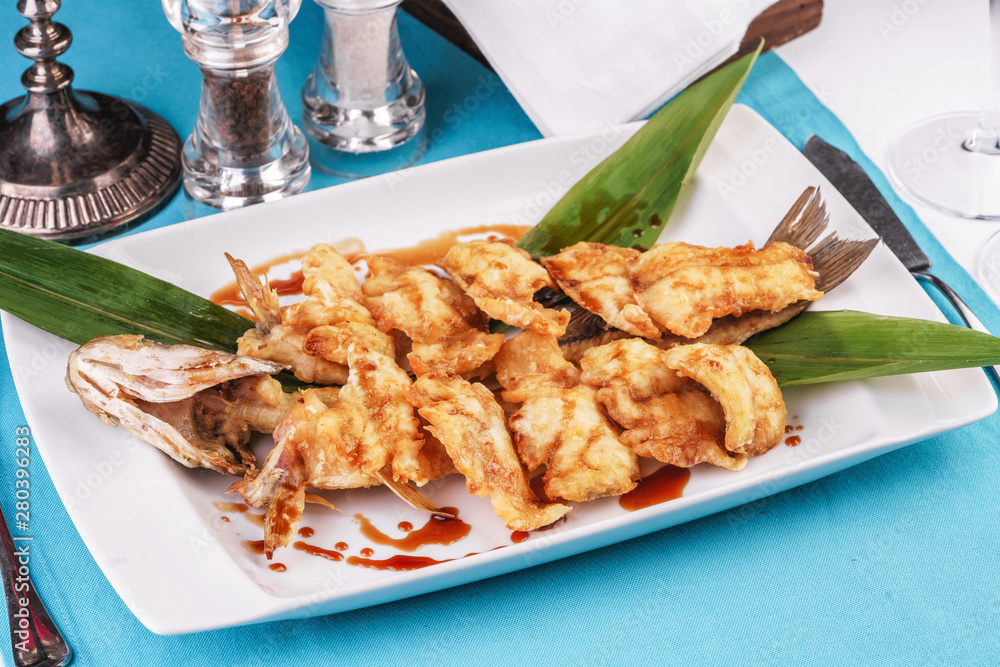 Nuggets fried in sea fish oil with bamboo according to the Georgian recipe. Mediterranean cuisine Nuggets fried in sea fish oil with bamboo according to the Georgian recipe. Mediterranean cuisine