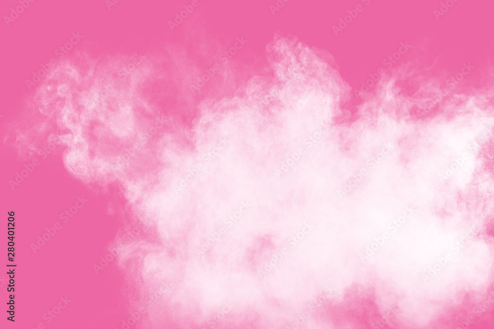 Abstract white powder explosion on pink background. Freeze motion of white dust splattered.