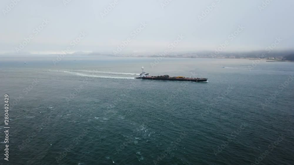Large crude oil cargo tanker floating across Pacific ocean Large crude oil cargo tanker floating across Pacific ocean