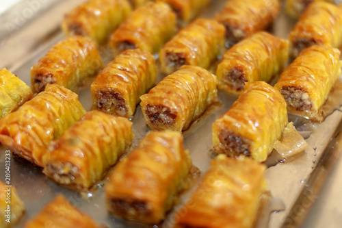 Pieces of baklava, traditional sweet dessert pastry made of layers of filo filled with chopped nuts and syrup