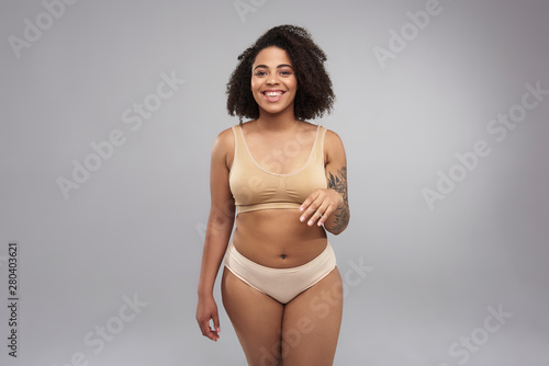 Happy Afro American woman posing for camera