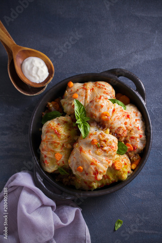 Cabbage rolls with meat, rice and vegetables. Stuffed cabbage leaves with meat. Chou farci, dolma, sarma, golubtsi or golabki photo