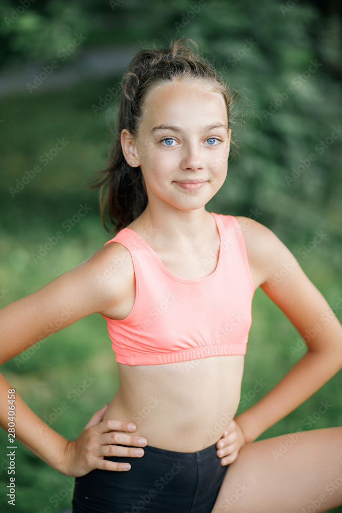 A pretty girl loves a teenager resting after an outdoor workout A pretty girl loves a teenager resting after an outdoor workout