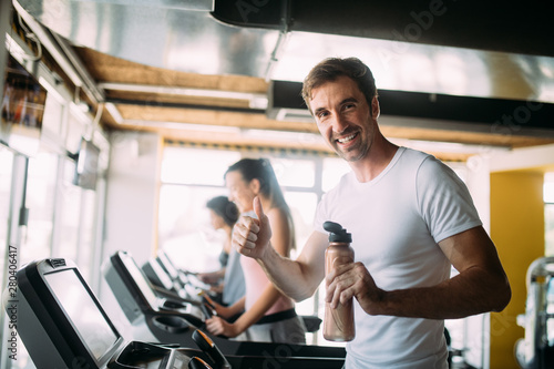 Picture of cheerful fitness team in gym