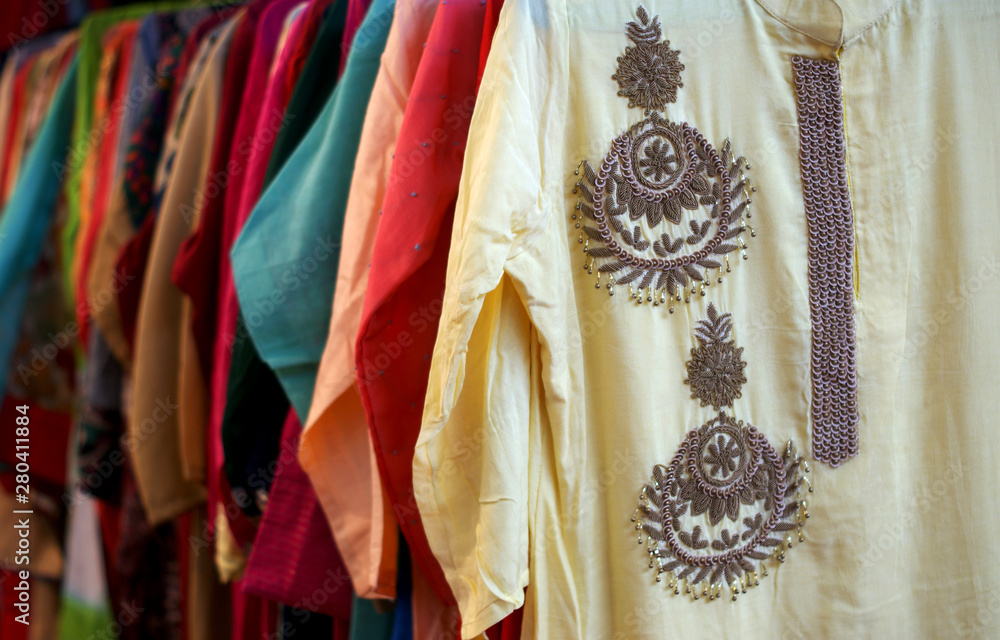 Closeup of Indian woman fashion dress salwar kameez in display of a retail shop    