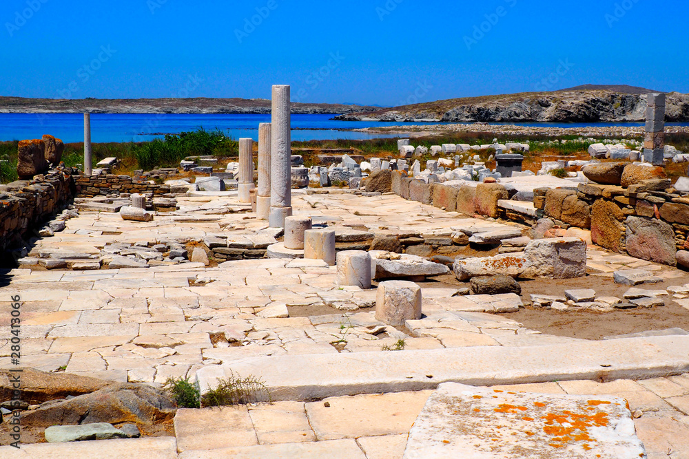 view of the ancient agora in the archaeological city of Delos Island, near Mykonos, beautiful Cycladic island, in the heart of the Aegean Sea view of the ancient agora in the archaeological city of Delos Island, near Mykonos, beautiful Cycladic island, in the heart of the Aegean Sea