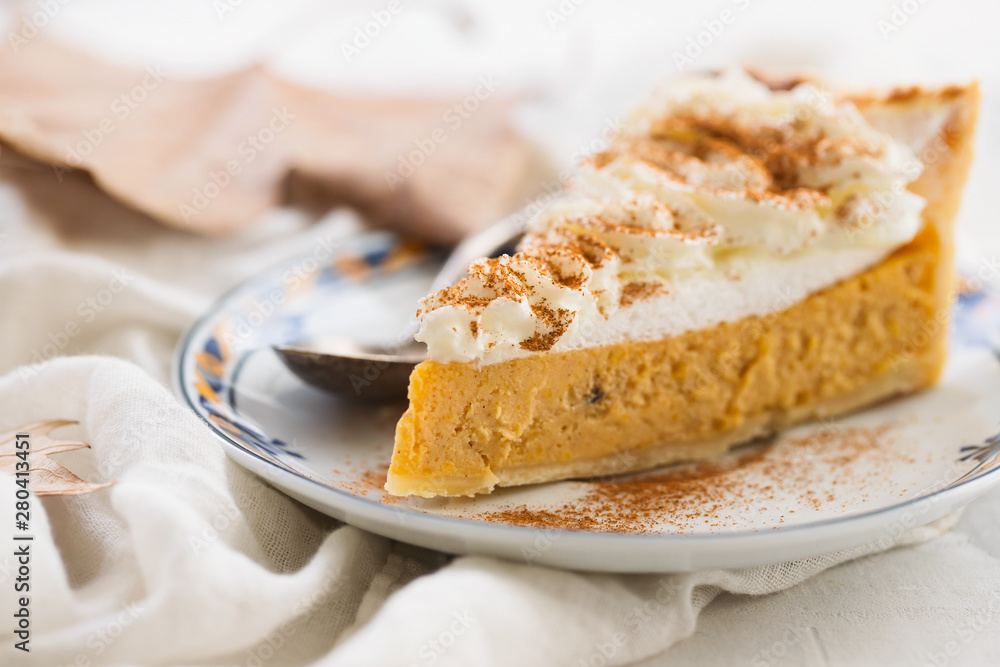 pumpkin cake with cream and cinnamon on dish pumpkin cake with cream and cinnamon on dish