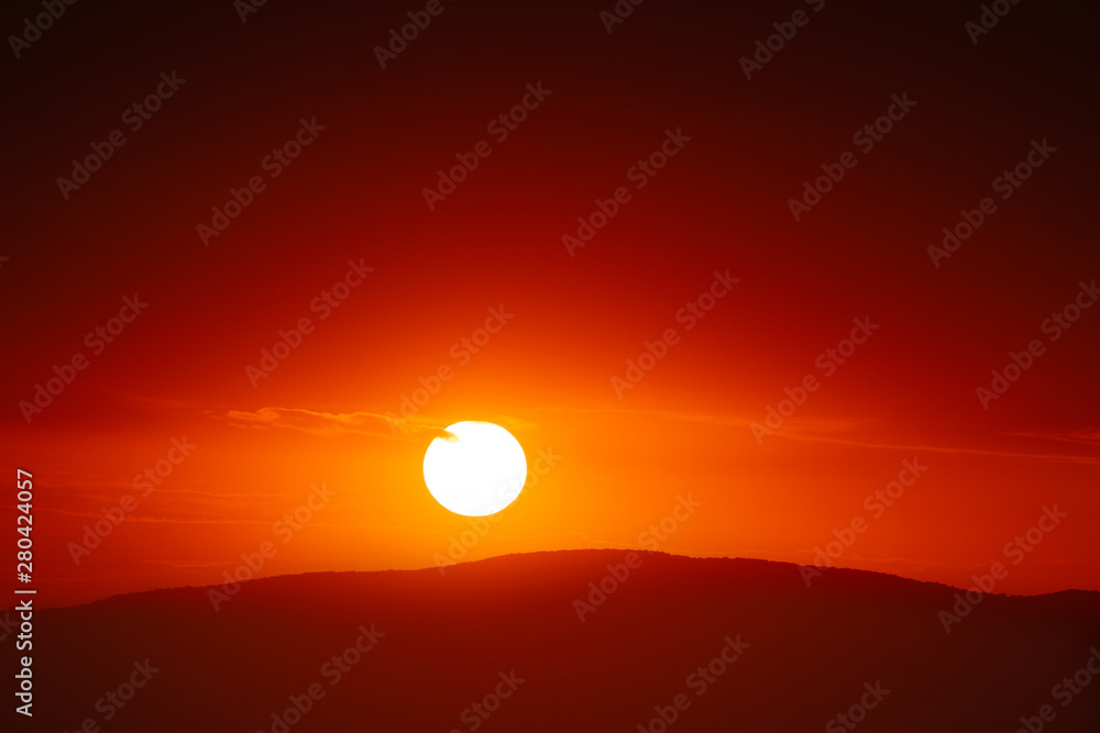 Beautiful sunset sky above clouds with dramatic light. Beautiful sunset sky above clouds with dramatic light.