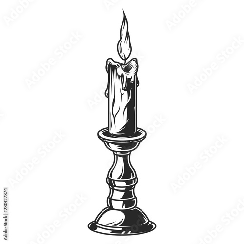 Burning candle in bronze candlestick