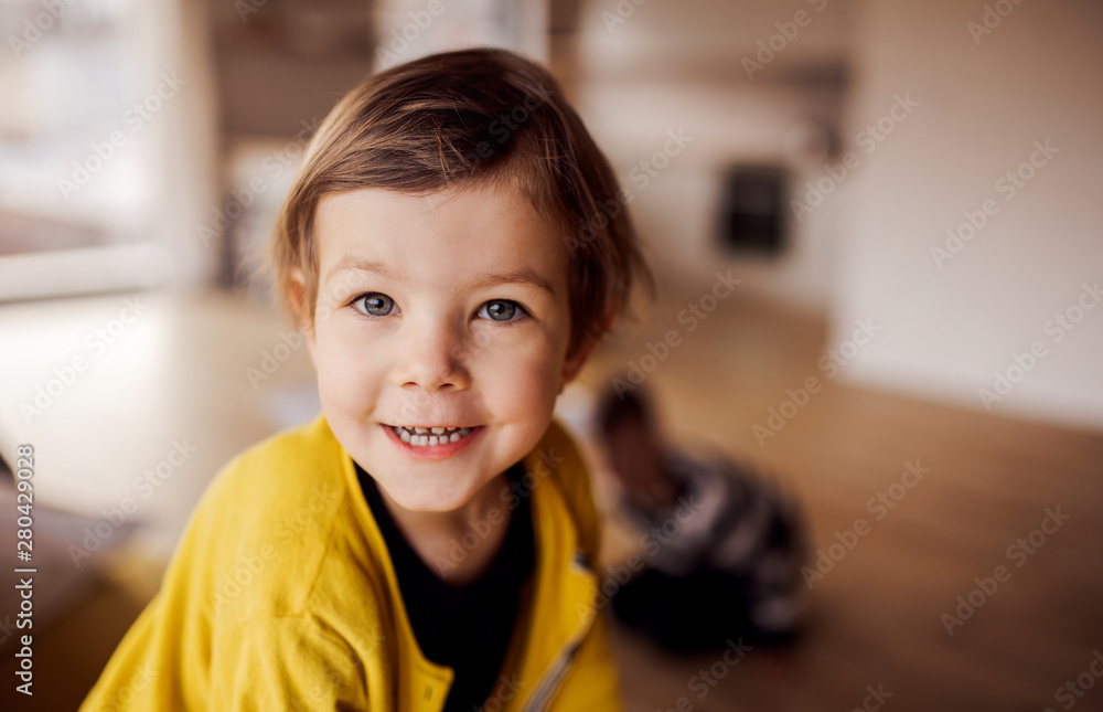 A happy small girl playing at home. Copy space. A happy small girl playing at home. Copy space.