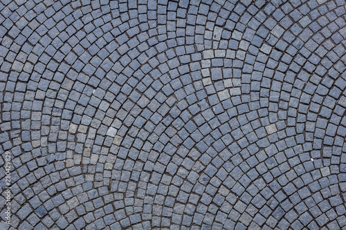 Un suelo de adoquines visto cenitalmente formado patrones circulares photo