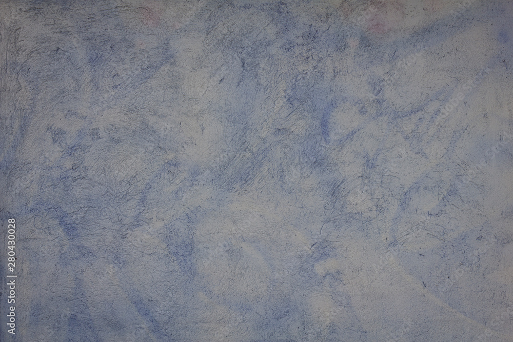 Fototapeta premium La superficie irregular de una pared, decorada con tonos azules y blancos