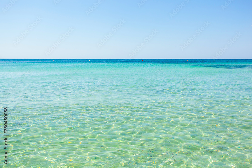 Beautiful sea with turquoise water and golden beach in Salento.