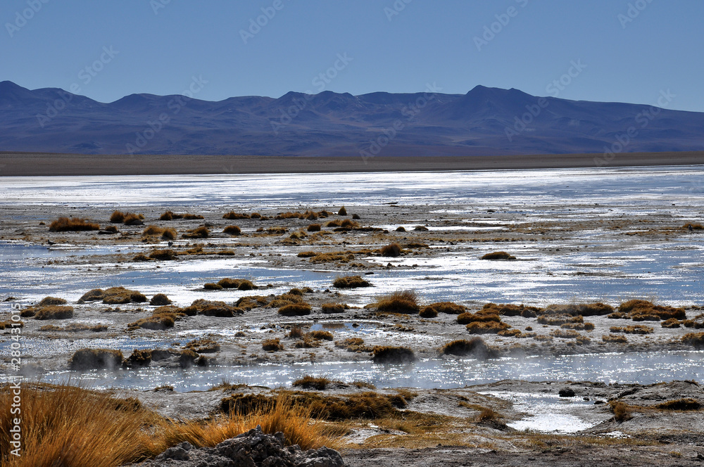 travelling through the andean mountains in bolivia, peru and chile to geysers, lagunas, la paz, city,