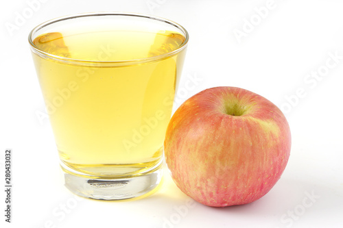 Red apple juice in glass and apple fruit isolated on white background
