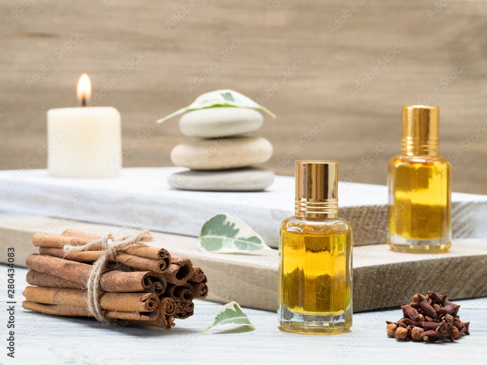 Natural aromatherapy and spa ingredients on a white and brown wooden background Natural aromatherapy and spa ingredients on a white and brown wooden background