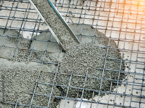 Concrete pouring during commercial concreting floors of buildings in construction site