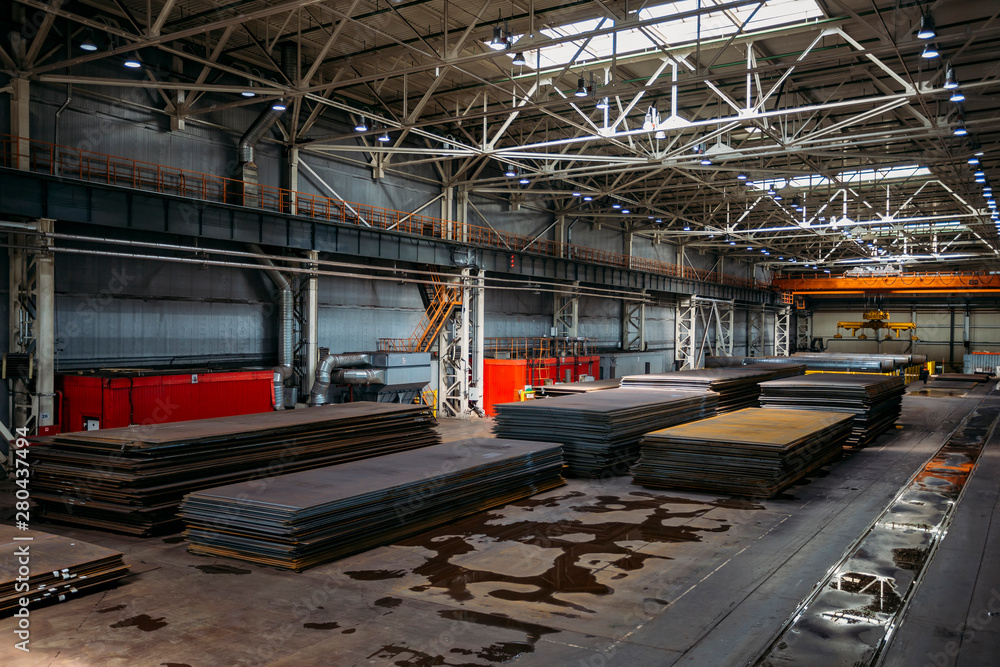 Stacks of steel sheets in warehouse Stacks of steel sheets in warehouse
