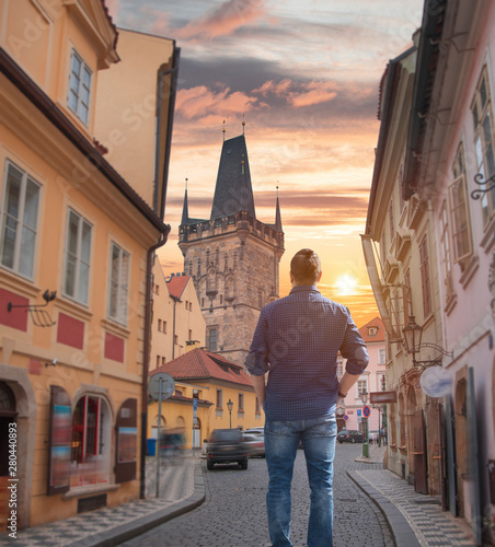 Photography man walks in Prague.