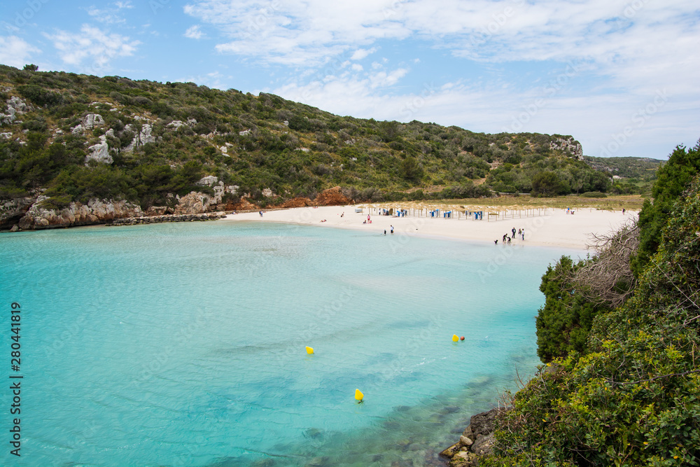 The beautiful beach of Cala en Porter photographed from the rocks.