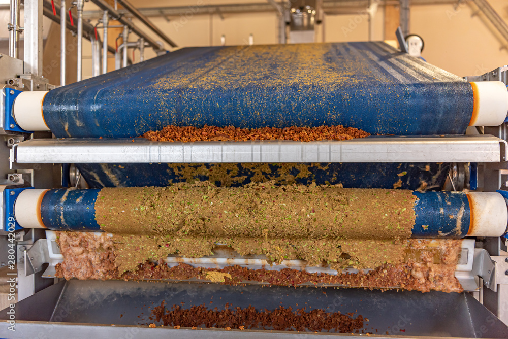 Modern Machine squeezes apples and apple pomace remain as press residues Modern Machine squeezes apples and apple pomace remain as press residues