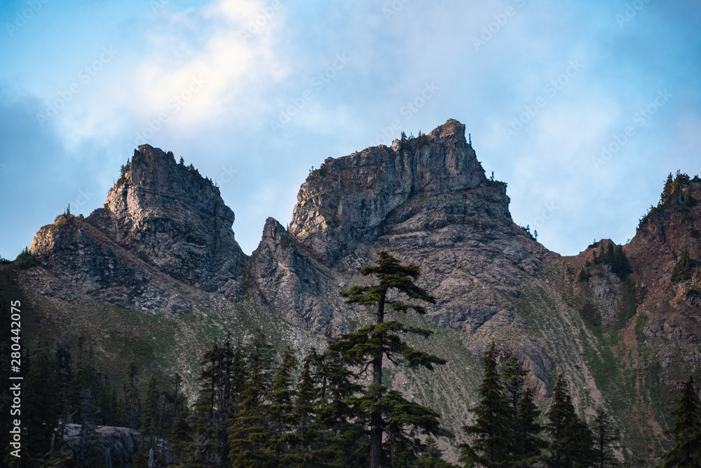 Jagged mountain peaks at sunrise in the Alpine Lake Wilderness. Central Cascade mountain range, Washington State, July 2019. Hibox Mountain.