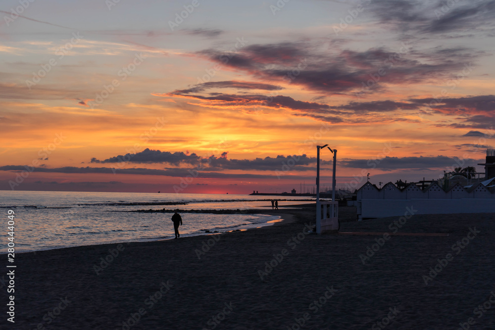 Sunset on the beach in Ostia Lido, Roma, Italy