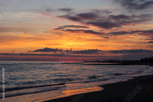 Sunset on the beach in Ostia Lido, Roma, Italy photo