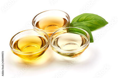 Vegetable, olive oil and apple vinegar in a bowl, isolated on white background
