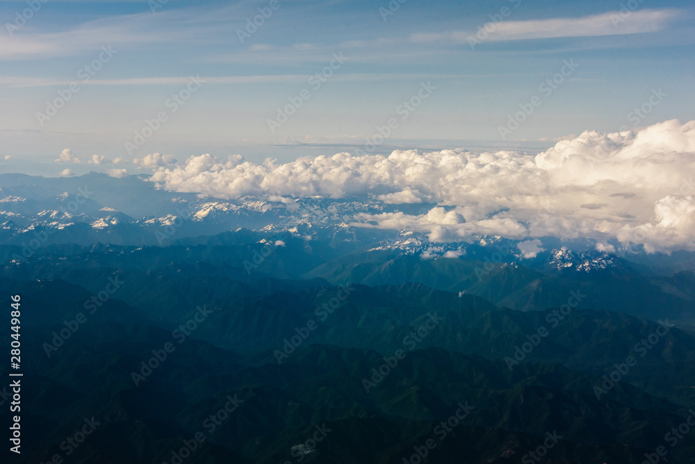 Western Washington coast seen from airplane, Puget Sound featured. Seattle in background.