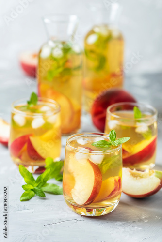 Summer cold tea with peaches and mint