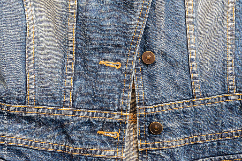 Closeup surface old jean jacket textured background Closeup surface old jean jacket textured background